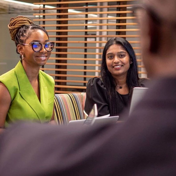 GM Employees collaborate in a meeting space